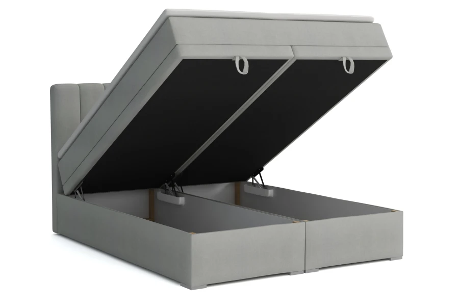Lichtgrijs boxspringbed David met twee grote, geopende bedbakken voor extra opbergruimte.