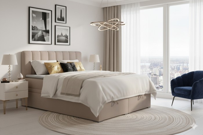 Beiges Boxspringbett David im modernen Schlafzimmer mit Bettkasten und urbanem Ausblick.