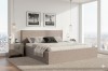 Modernes Polsterbett in Beige mit geripptem Stoff im hellen Schlafzimmer mit Stadtblick.