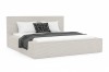 Beiges Polsterbett in Cord-Optik mit grauer Strickdecke und Kissen vor weißem Hintergrund.