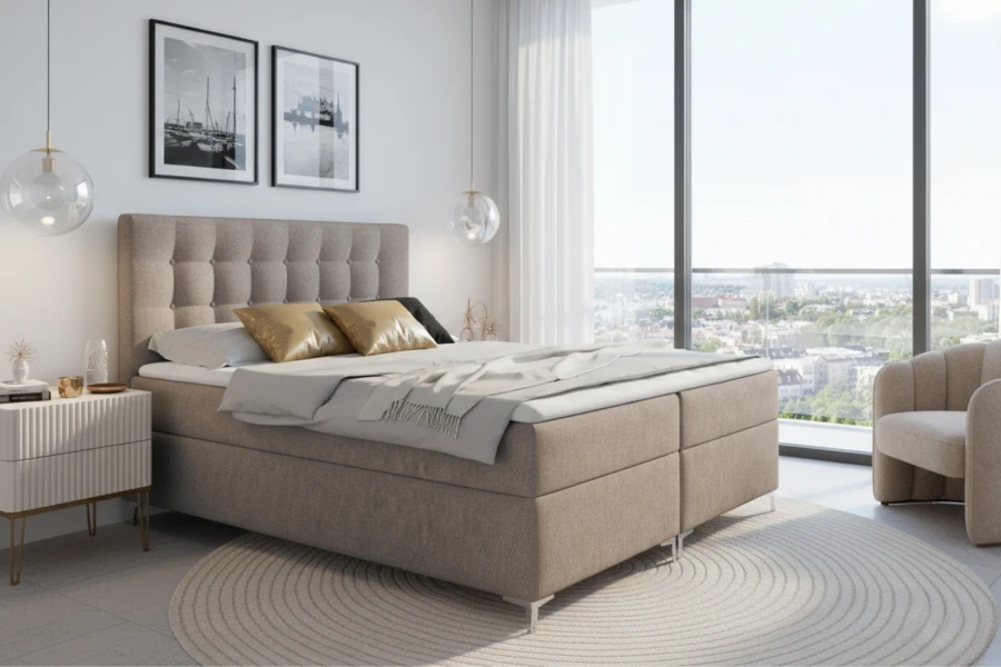 Beiges Boxspringbett Erik in einem hellen, modern eingerichteten Schlafzimmer.