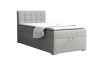 Lichtgrijs boxspringbed eenpersoonsbed met gecapitonneerd hoofdbord tegen een witte achtergrond.