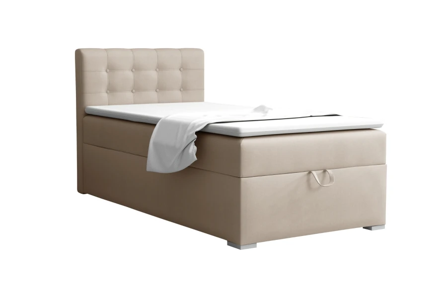 Single boxspring bed in beige with quilted headboard on a white background.