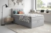 Modern bedroom set with grey box spring bed and stylish decoration.
