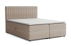 Beige boxspringbed met opbergruimte en gecapitonneerd hoofdbord vrijstaand.