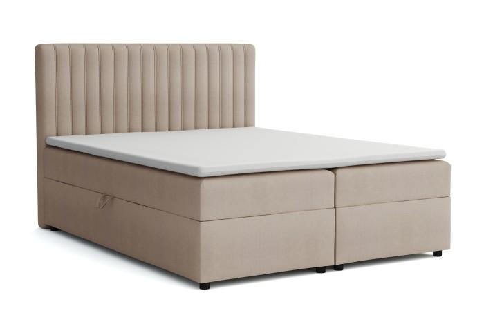 Beige boxspringbed met hoog hoofdbord en praktische opbergruimte