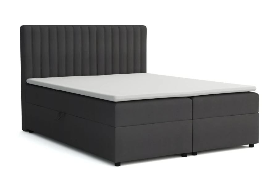Donkergrijze boxspring met gestreept hoofdbord op een witte achtergrond