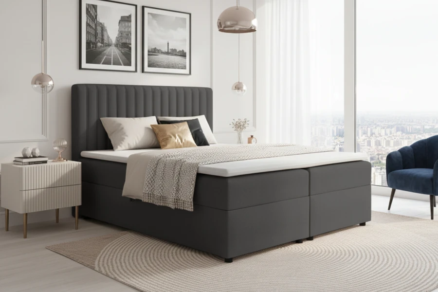 Dunkelgraues Boxspringbett in modernem Schlafzimmer-Ambiente.