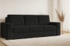 Schwarzes Cordsofa in gemütlicher Wohnzimmer-Umgebung mit Teppich