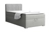 Modern grey single box spring bed with vertically quilted headboard on a white background.