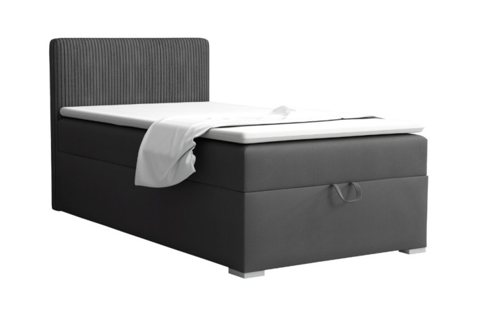 Dark grey single box spring bed with vertically quilted headboard on a white background.