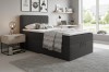 Stylish youth room with modern anthracite-coloured box spring bed and decoration.