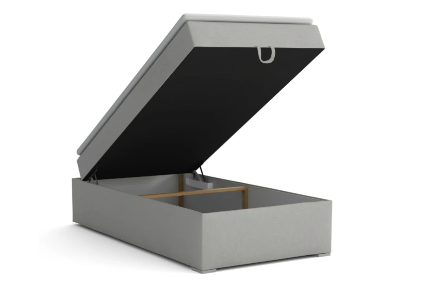 Open boxspring bed with practical bed base for additional storage space in light grey.