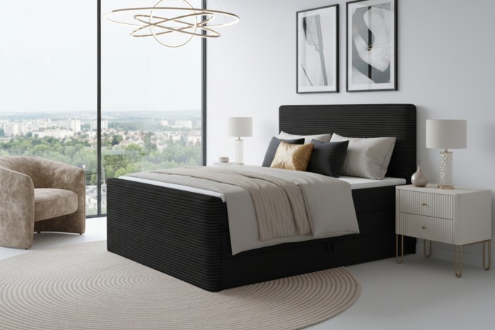 Elegantes Schlafzimmer-Design mit schwarzem Boxspringbett in Cord-Optik.