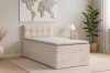 Stilvolles Jugendzimmer mit beigem Boxspringbett, Wanddeko und Teppich für gemütliches Wohnen.