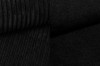 Detailansicht schwarzer Cord- und Polsterstoff für Boxspringbetten.