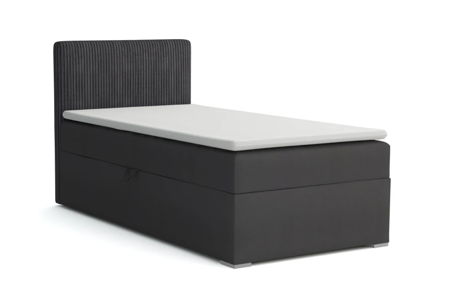 Dunkelgraues Boxspringbett mit vertikal gestepptem Kopfteil und komfortabler Auflage.