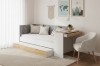 Weißes Funktionsbett mit Ausziehbett und integriertem Schreibtisch in Eiche-Optik für das Kinderzimmer.