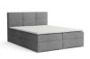 Graues Boxspringbett mit hohem Kopfteil und weißer Topper-Auflage, freigestellt auf weiß.