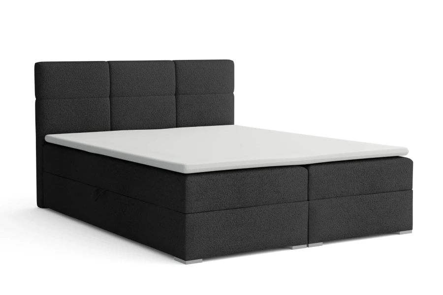 Anthrazitfarbenes Boxspringbett mit dreigeteiltem Kopfteil auf weißem Hintergrund.