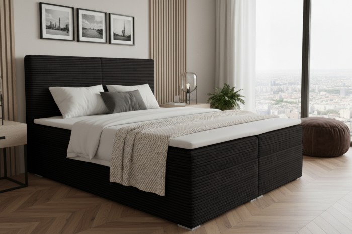 Black boxspring bed with textured fabric in a modern setting with a city view.