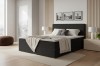 Modernes Boxspringbett in Anthrazit mit Cord-Optik im Schlafzimmer.