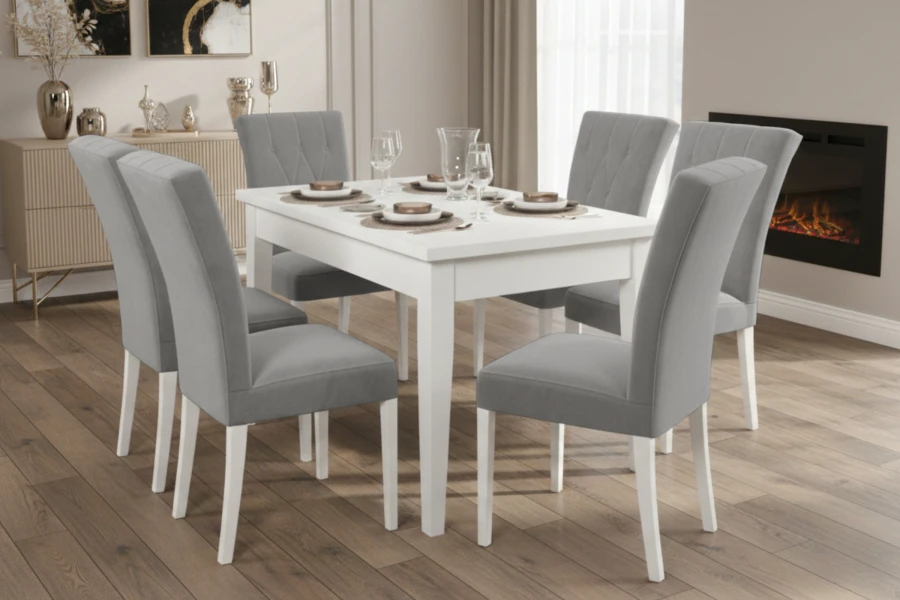 Essgruppe mit weißem Esstisch und 6 grauen Polsterstühlen in modernem Esszimmer mit Kamin