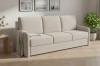 Beiges 3-Sitzer Sofa mit Bouclé-Stoff in modernem Wohnzimmer.