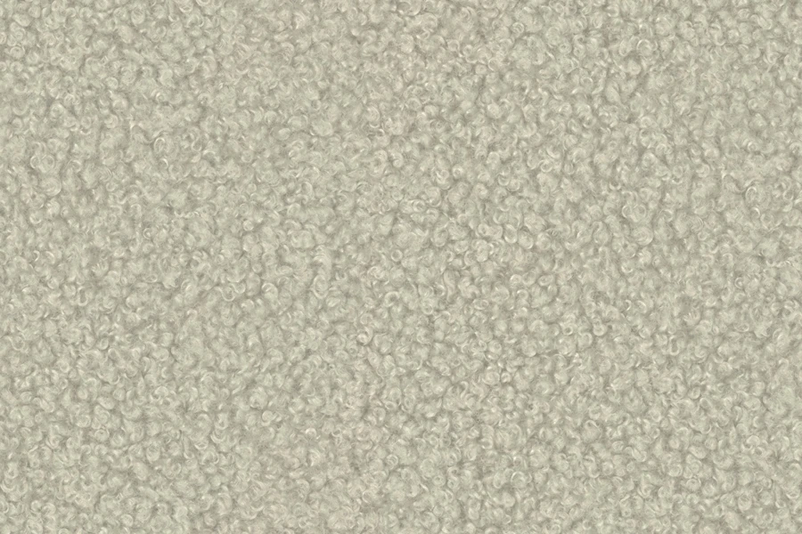 Nahaufnahme von beigem Bouclé-Stoff mit weicher, lockiger Textur.