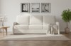 Cremefarbenes 3-Sitzer Sofa in hellem, modernen Wohnzimmer-Ambiente.