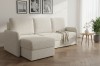 Modernes Ecksofa in Beige im gemütlichen Wohnzimmer-Ambiente.