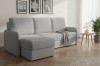 Hellgraue Eckcouch im Wohnzimmer mit Holztisch und Wandbildern