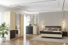 Modernes Schlafzimmer-Set mit Holzschrank, Bett und Kommode in Eiche und Schwarz.