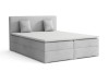 Hellgraues Boxspringbett mit Polsterkopfteil und Kissen