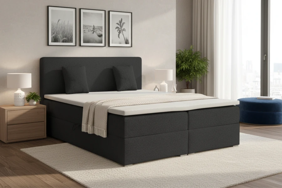 Modernes anthrazitfarbenes Boxspringbett in einem stilvollen Schlafzimmer mit Wandbildern und Deko.
