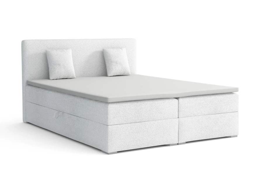 Weißes Polsterbett als Boxspringbett-Modell, freigestellt auf weißem Hintergrund.