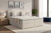 Beiges Boxspringbett im Schlafzimmer-Setting mit passender Dekoration und gemütlicher Atmosphäre.