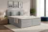 Modernes graues Boxspringbett in einem hellen Schlafzimmer mit stilvoller Dekoration.