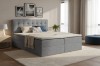 Modern eingerichtetes Schlafzimmer mit gemütlichem Boxspringbett Cindy in Hellgrau und Dekoration.