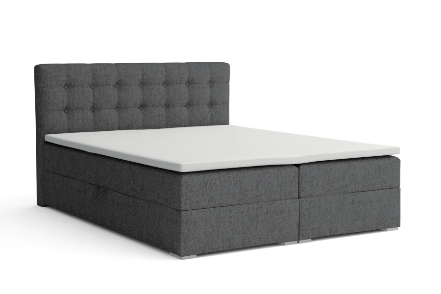 Graues Boxspringbett mit Topper und Stauraum vor weißem Hintergrund