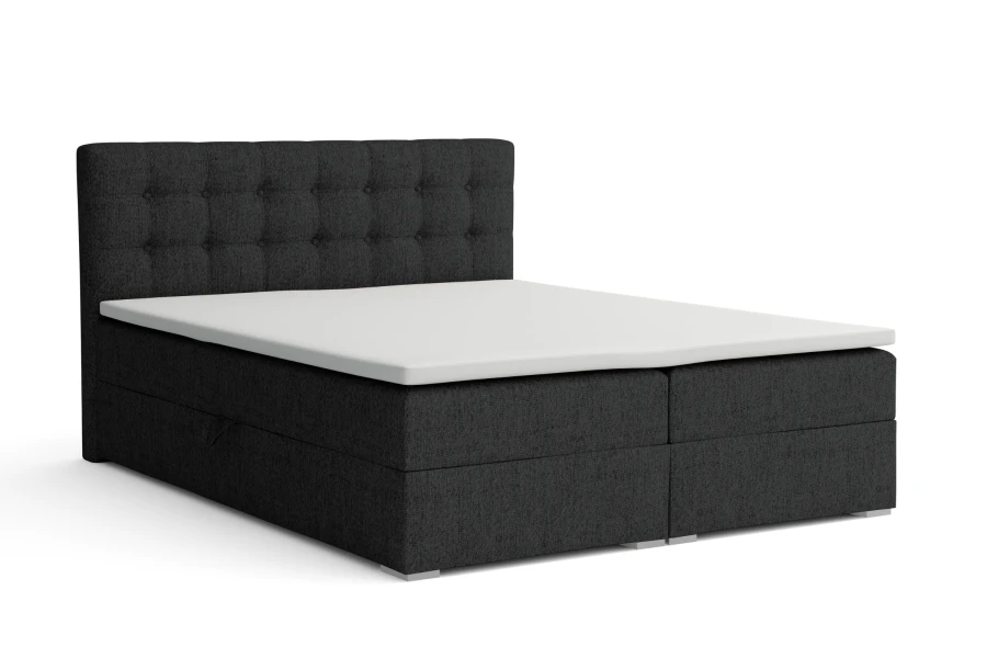 Modernes dunkelgraues Boxspringbett mit gepolstertem Kopfteil und weißer Matratze.