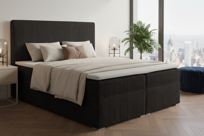 Antracietkleurig boxspringbed van ribfluweel met een gezellige inrichting in penthouse-stijl.