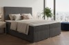 Boxspringbett in Dunkelgrau mit Cord-Struktur für modernes Wohnen.