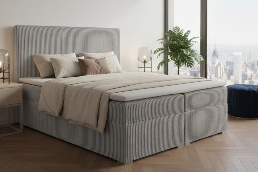 Modernes graues Boxspringbett in Cord-Optik mit hohem Kopfteil und Stadtblick