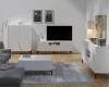 Helle Wohnzimmermöbel in Weiß mit Lamellen-Optik für ein modernes Zuhause.