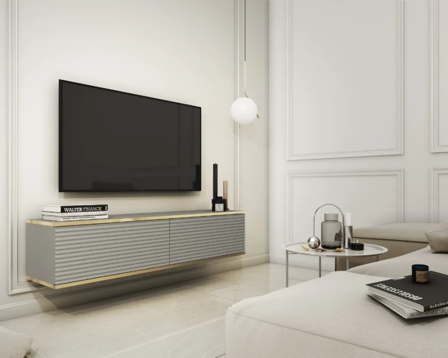 Elegantes graues TV-Board hängend mit Golddetails in einem modernen hellen Wohnzimmer.