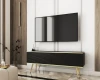 Modernes TV-Board in Schwarz und Gold in einem stilvollen Wohnzimmer.