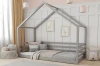 Modernes Hausbett in Grau für Jungen und Mädchen mit dekorativen Kissen und Wandbildern.