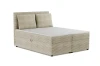 Beiges Boxspringbett aus Cord mit zwei Kissen, Seitenansicht vor weißem Hintergrund.
