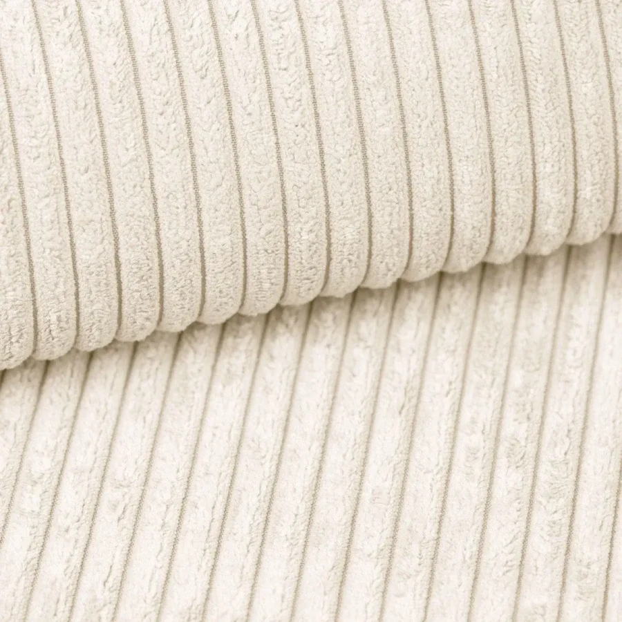 Detailaufnahme der beigen Cord-Stoffstruktur für hochwertige Polstermöbel und Betten.